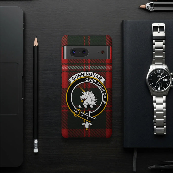 Cunningham Over Fork Over tartan phone case flat lay — full unicorn crest and plaid design visible