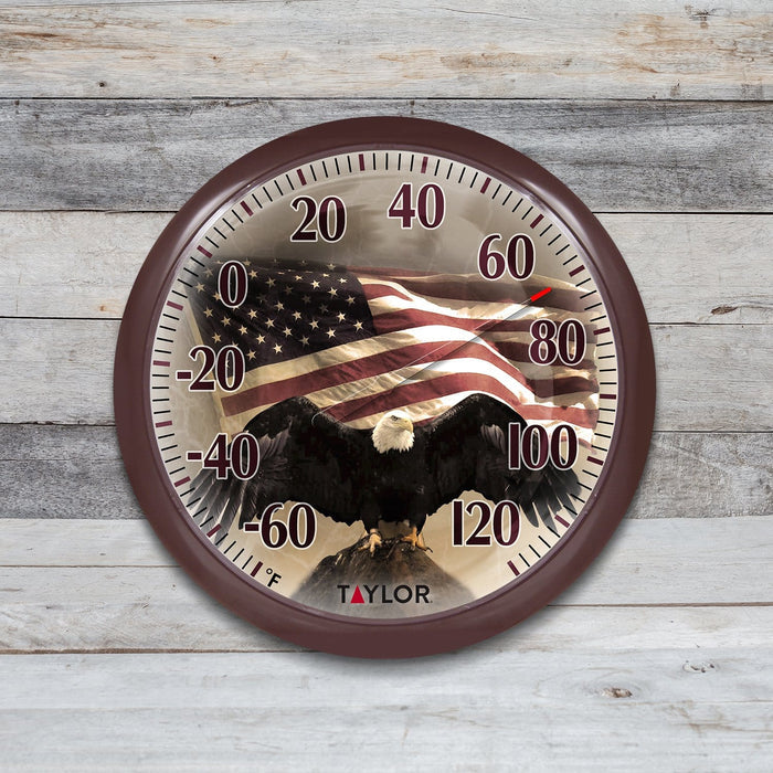 Round patriotic thermometer featuring American flag and bald eagle with bold Fahrenheit numerals
