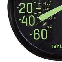 Close-up of the glow in the dark thermometer dial with large green negative temperature markings