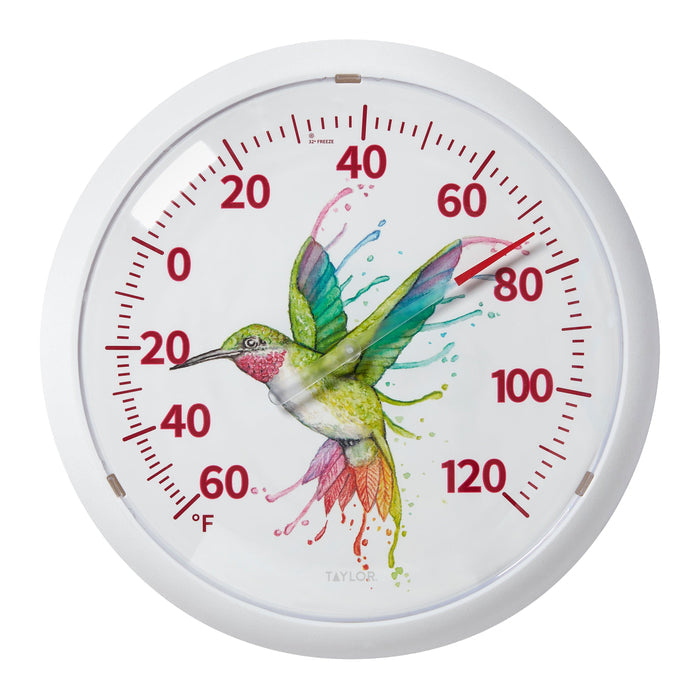 Round white framed thermometer with watercolor hummingbird and rainbow droplets on the dial