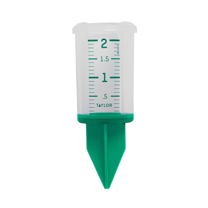 Close-up of a 2 inch silicone sprinkler gauge with green markings on a white housing.