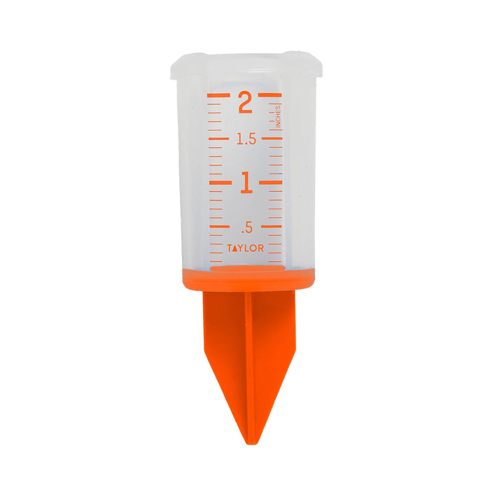 Orange 2 inch silicone sprinkler gauge with clear measurement markings and pointed nozzle