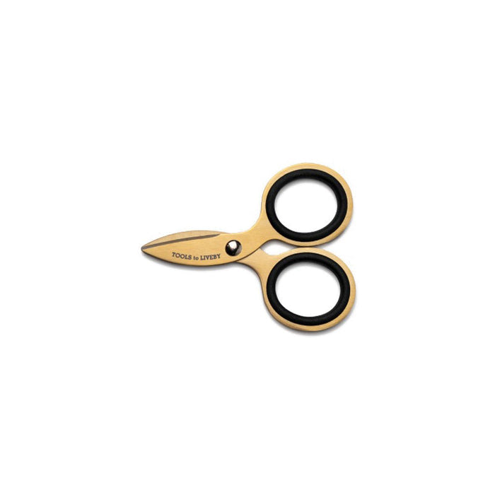 Small gold steel scissors on white background