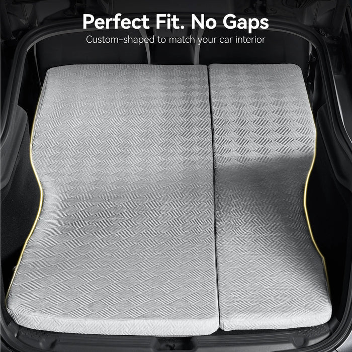 3W custom car camping mattress perfectly fitted inside the trunk of a Tesla Model Y Juniper with no gaps, showing the custom-shaped edges.