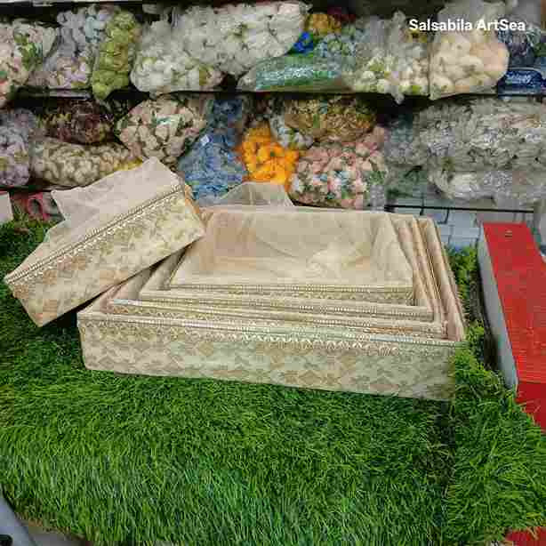 Gold square baskets arranged for wedding gift hamper
