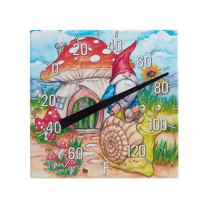 Front view of an 8x8 inch ceramic tabletop thermometer with a gnome, red mushroom, sunflowers, and blue sky