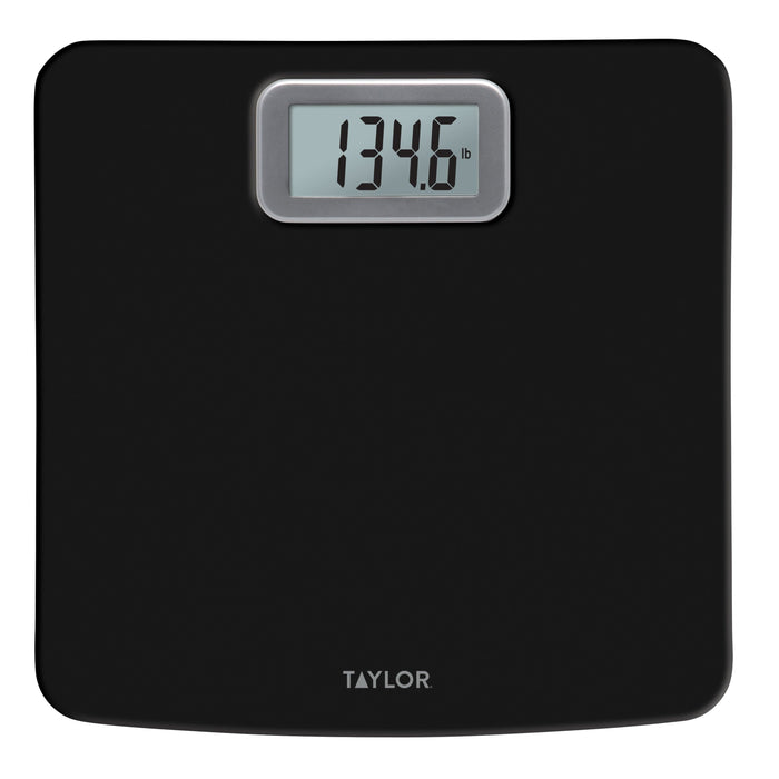 Black antimicrobial digital scale close-up with a digital readout showing 134.6 lb