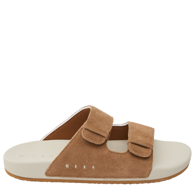A brown and white Reef sandal designed for kids with two straps and a soft footbed.