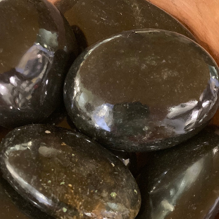 Black jade palm stone