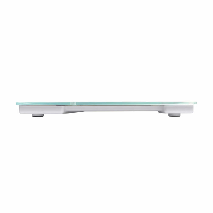 White glass body composition scale with blue backlit display on a light tiled floor