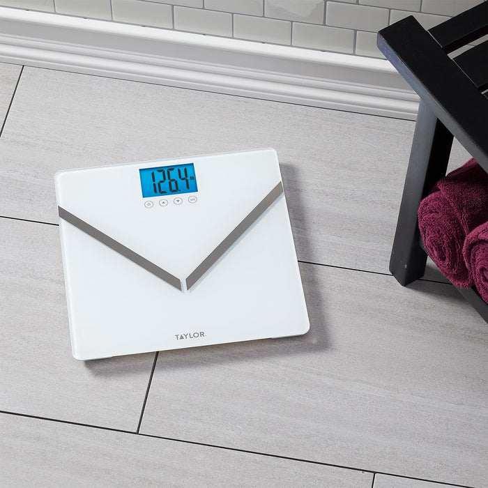 Front view of the white glass scale with blue digital display showing weight and Taylor logo on the glass top