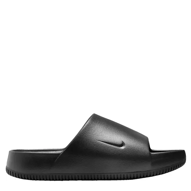 A black Nike slide sandal with a contoured design and a textured footbed.