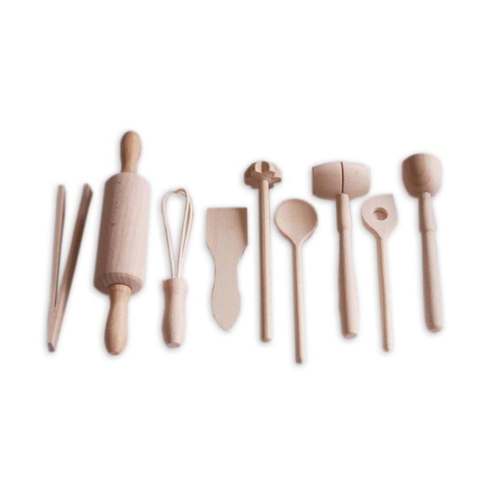 Set of wooden kitchen utensils including a rolling pin and spatulas on a white background