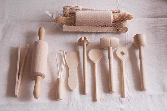 Set of wooden kitchen utensils including rolling pins and spoons