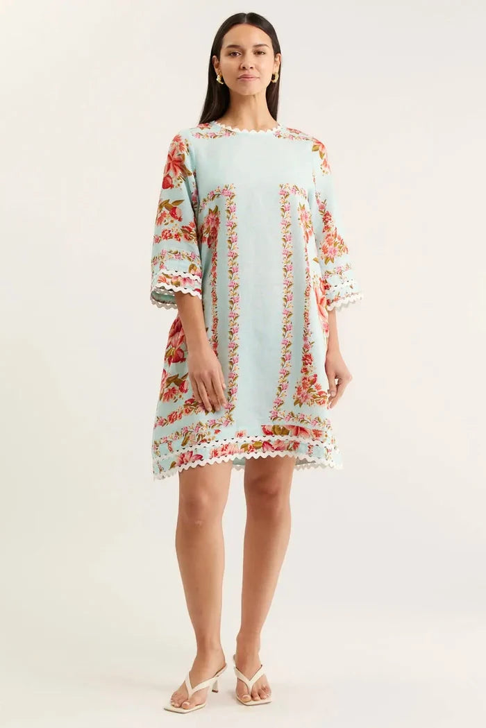 Woman wearing a floral dress on a white background
