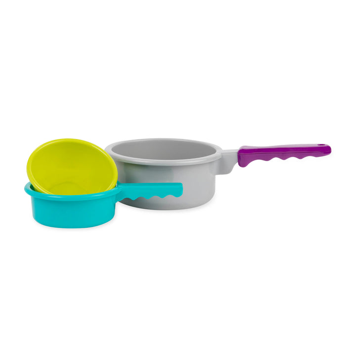 A toy cooking set with a huge variety of different tools in a green bin.