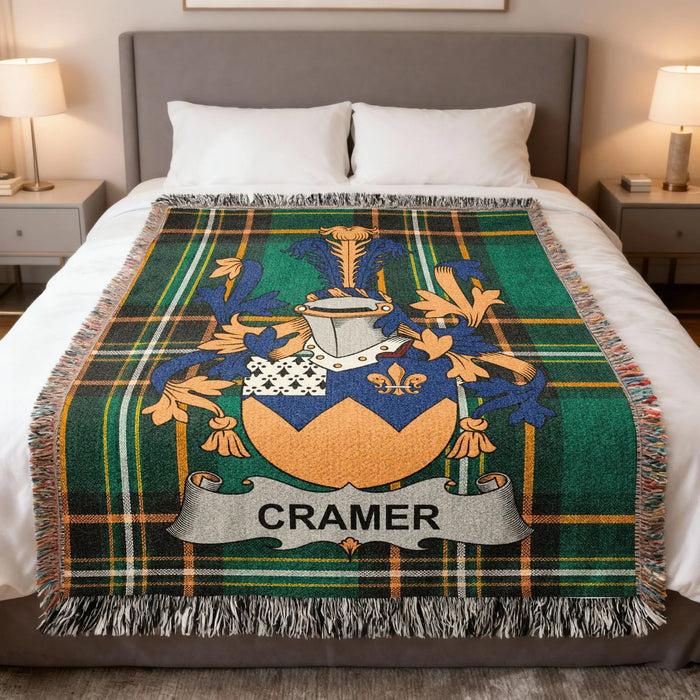 Cramer Irish family crest woven cotton blanket displayed on a bed