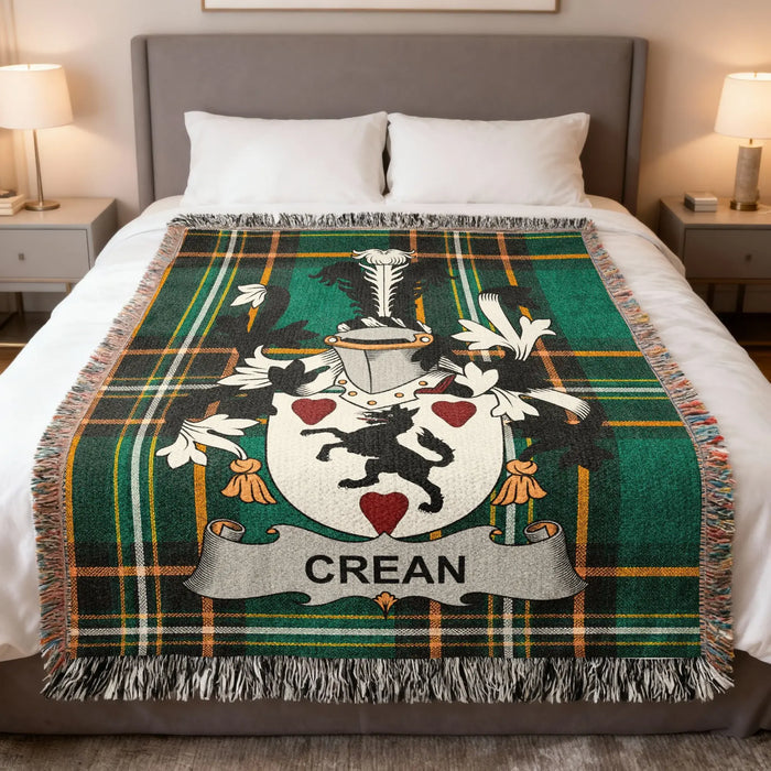Crean Irish family crest woven cotton blanket displayed on a bed