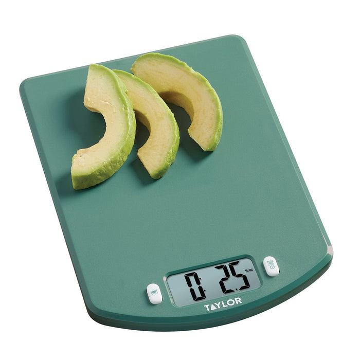 Teal ocean bound plastic kitchen scale topped with avocado slices and a digital readout.