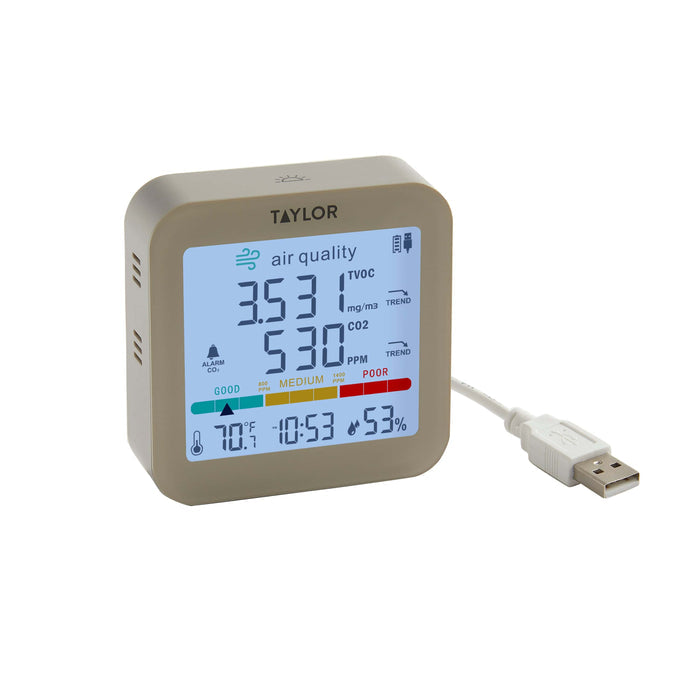 Taylor air quality monitor with USB cord displaying CO2 TVOC and other air quality stats.