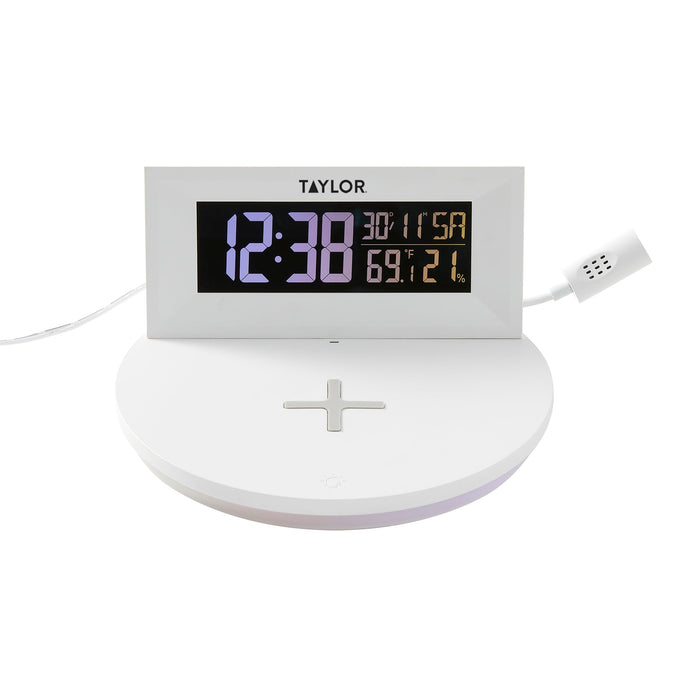 White digital mood light weather station with a large blue LED time display and built in wireless charging pad