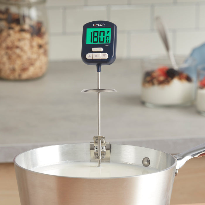 Taylor digital high heat candy thermometer inserted into a metal pot for candy making