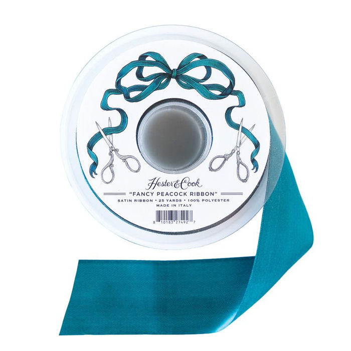 A spool of deep teal satin ribbon by Hester & Cook on a white background.