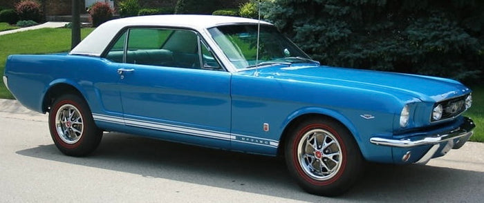A blue Ford Mustang GT convertible with a visible VIN number on the side.