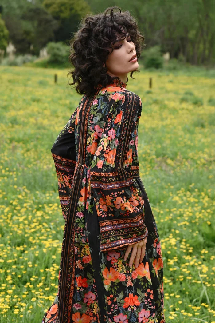 Woman in a floral dress standing in a field with yellow flowers