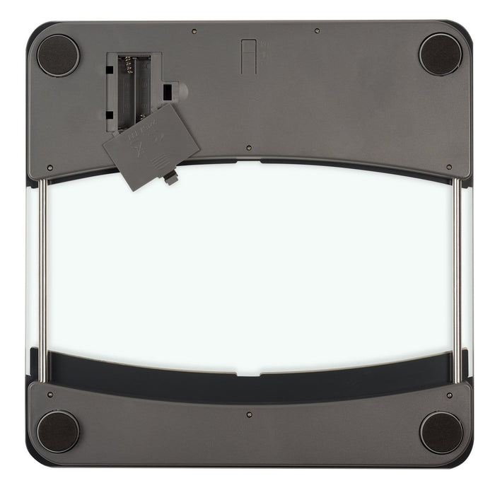 Back view of a glass body composition scale with its battery compartment open and battery partially inserted