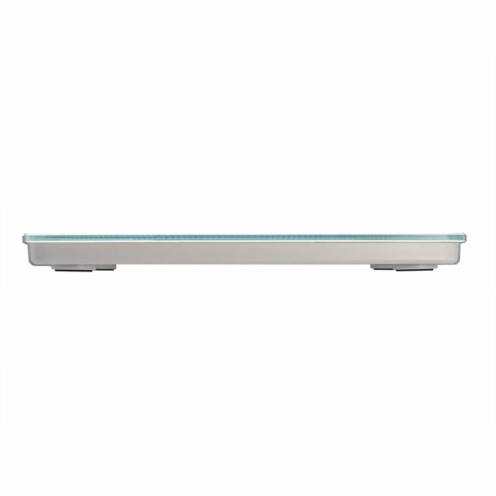 Profile view of white glass digital bathroom scale with glass top and chrome edge.