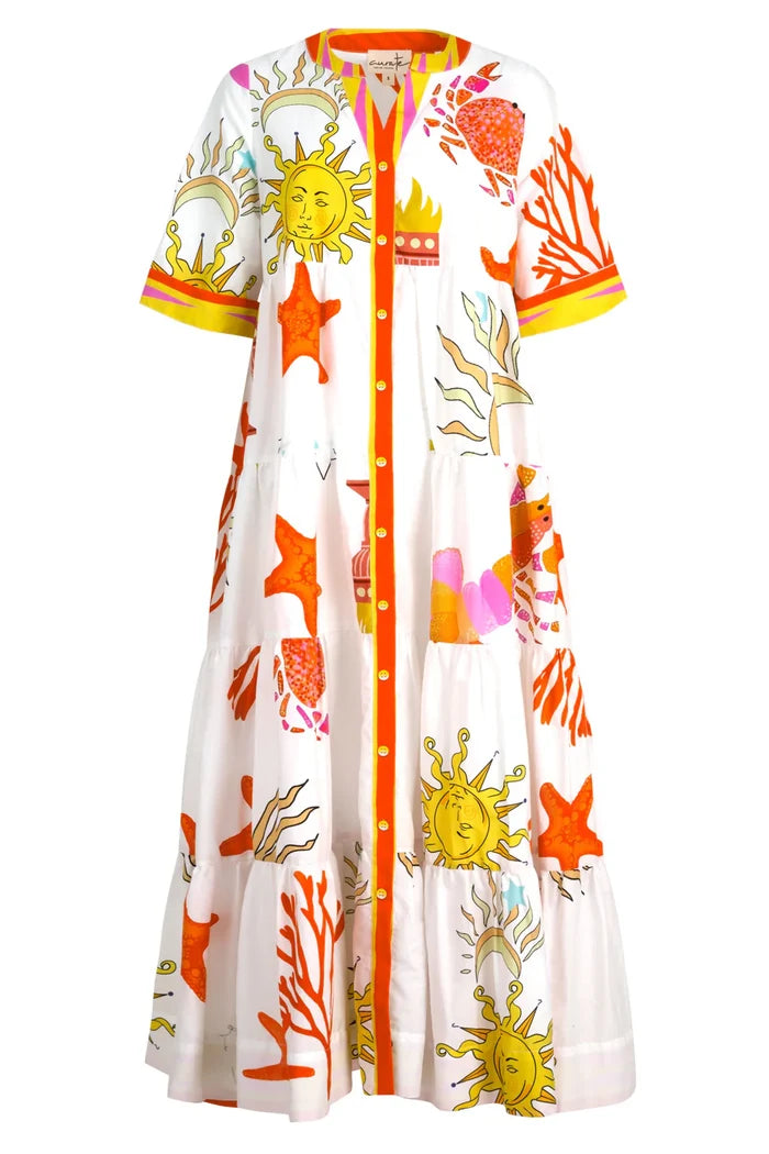 Colorful beach dress with sun and starfish patterns on a white background