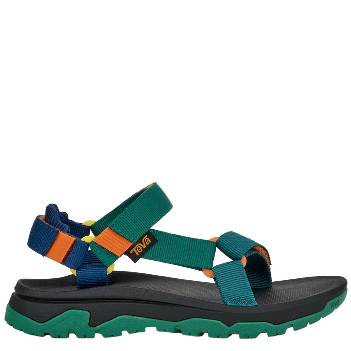 Colorful sandal with green strap and black sole on a white background