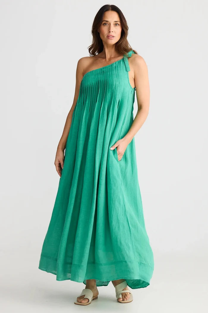 Woman wearing a green one-shoulder dress on a white background
