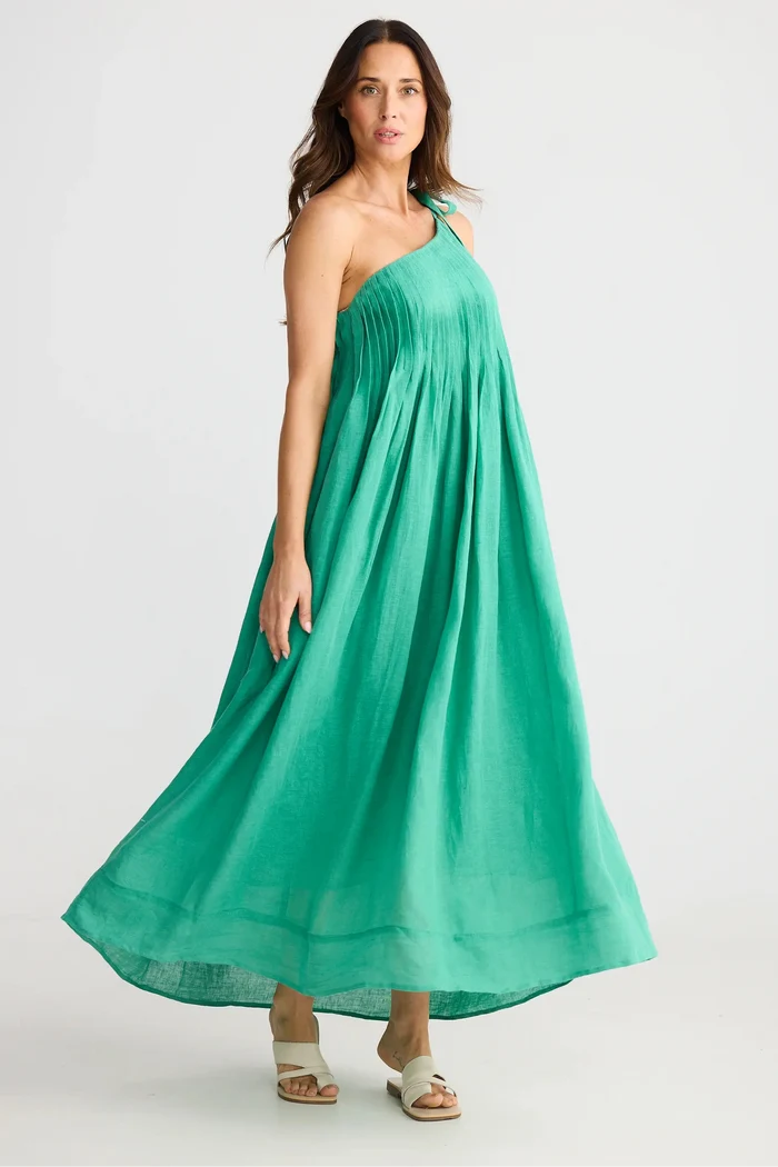 Woman wearing a green dress on a white background