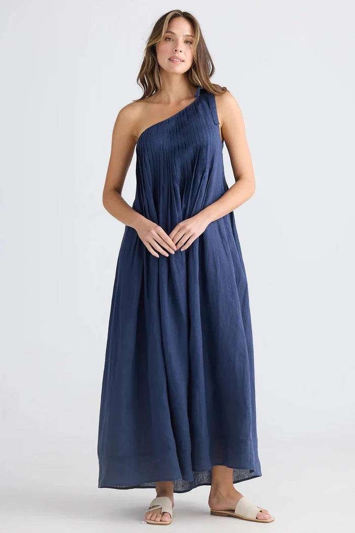 Woman wearing a blue one-shoulder dress on a white background