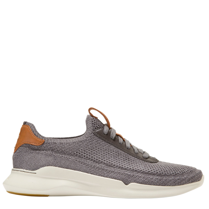 A pair of men's Cole Haan Grand Crosscourt Stitchlite sneakers in gray color with a lace-up closure and a white sole.