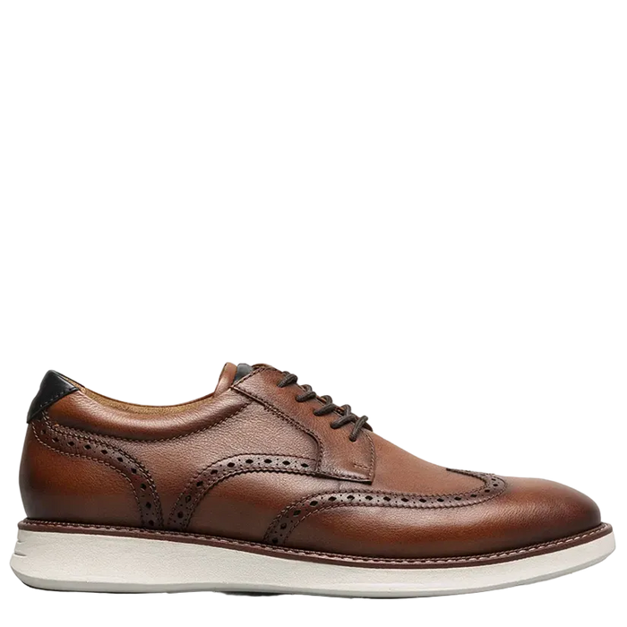 White sneaker with a patterned sole on a white background