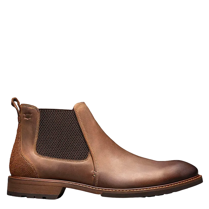 Brown leather Chelsea boot on a white background