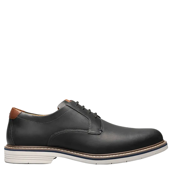 Black leather shoe on a white background