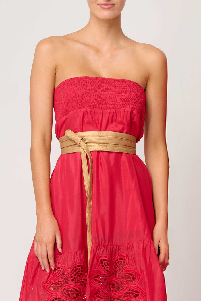 Red strapless dress with a gold belt on a white background . Once Was Milton Belt Gold.