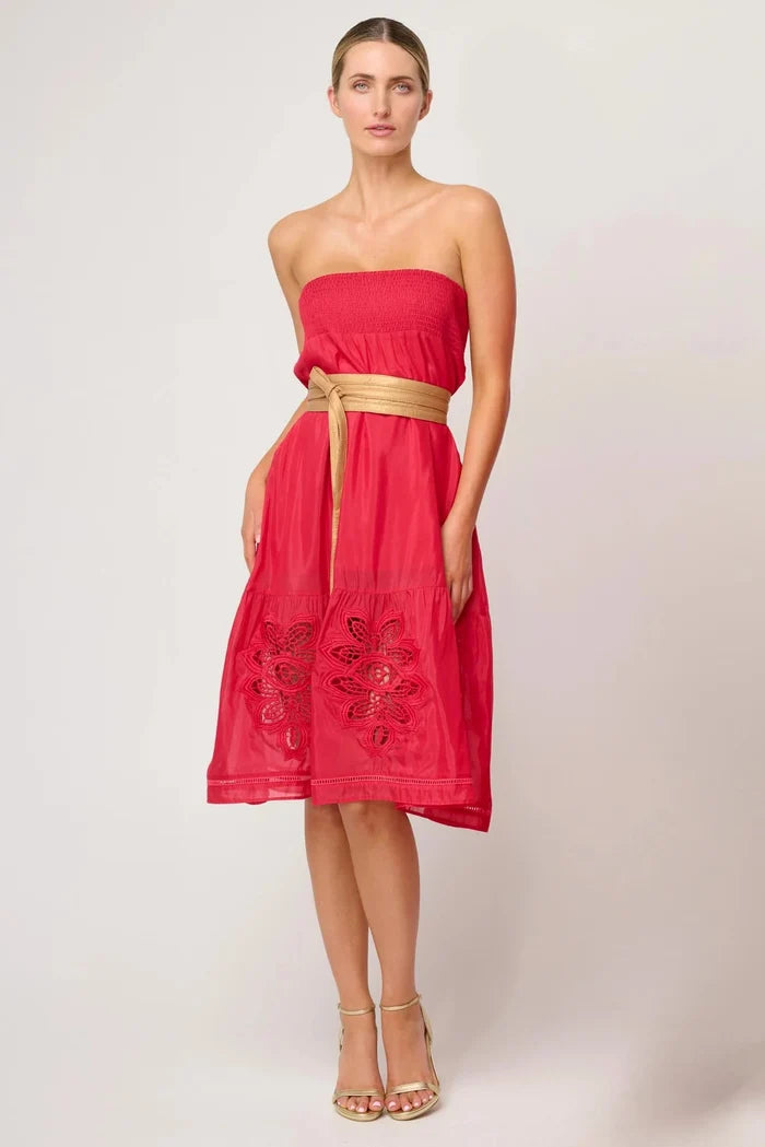 Woman wearing a red strapless dress with gold belt on a white background. Once Was Milton Belt Gold.