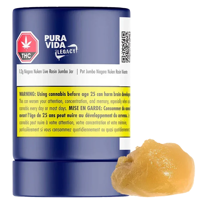 Front-facing view of a blue jar labeled "Niagara Nuken Jumbo Jar Rosin" by Pura Vida Legacy with a yellow warning band and a dollop of amber rosin beside it