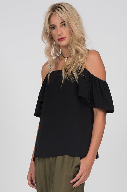 Model is wearing the Off-Shoulder Silk Cami Top in black, with the Hammered Silk Belted Pants in olive.