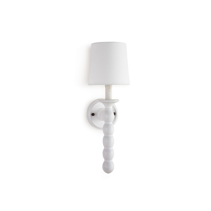 A hand-lathed wood Perennial sconce with a rustic finish and faux drip wax details.