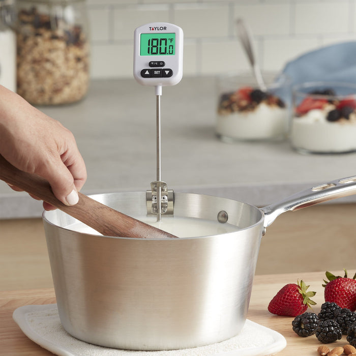 Taylor programmable digital candy and deep fry thermometer with probe over a stainless steel pot; display reads 180.0°F
