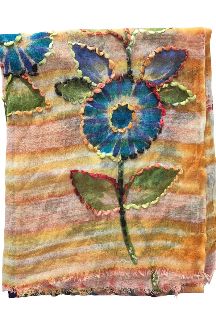Decorative blanket with floral patterns on a white background
