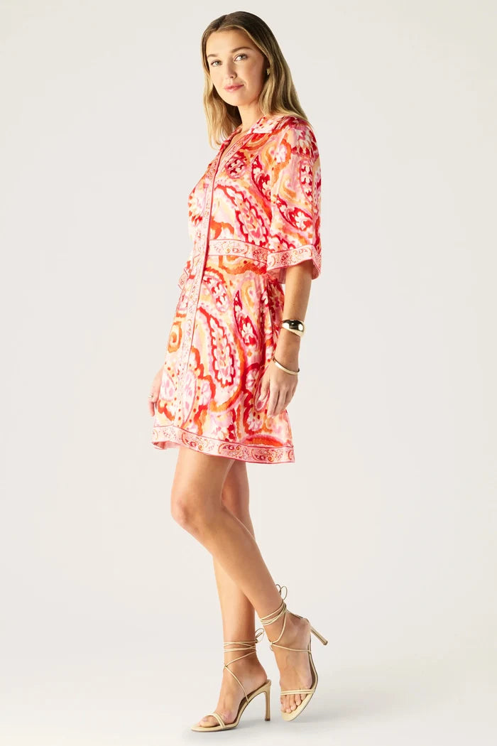 Woman wearing a floral dress on a white background