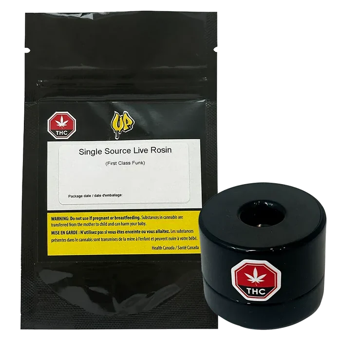 Front-facing shot of the Single Source Live Rosin black resealable pouch with label visible, shown next to a glossy black round container.
