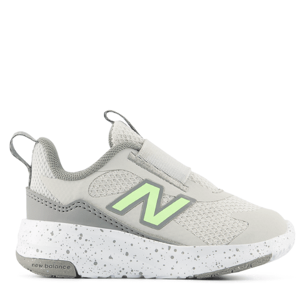Gray children's sneaker with a green logo on a white background
